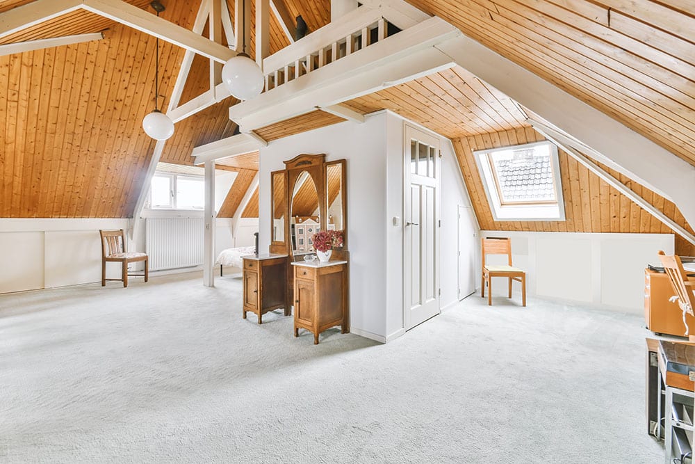 Newly finished attic with vanity and chairs
